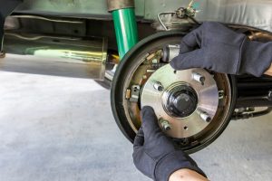 Panel Beater Doing Repairs on Brake